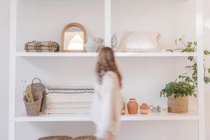 A person walking through a store shopping for home goods