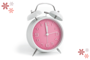 White clock with pink accents