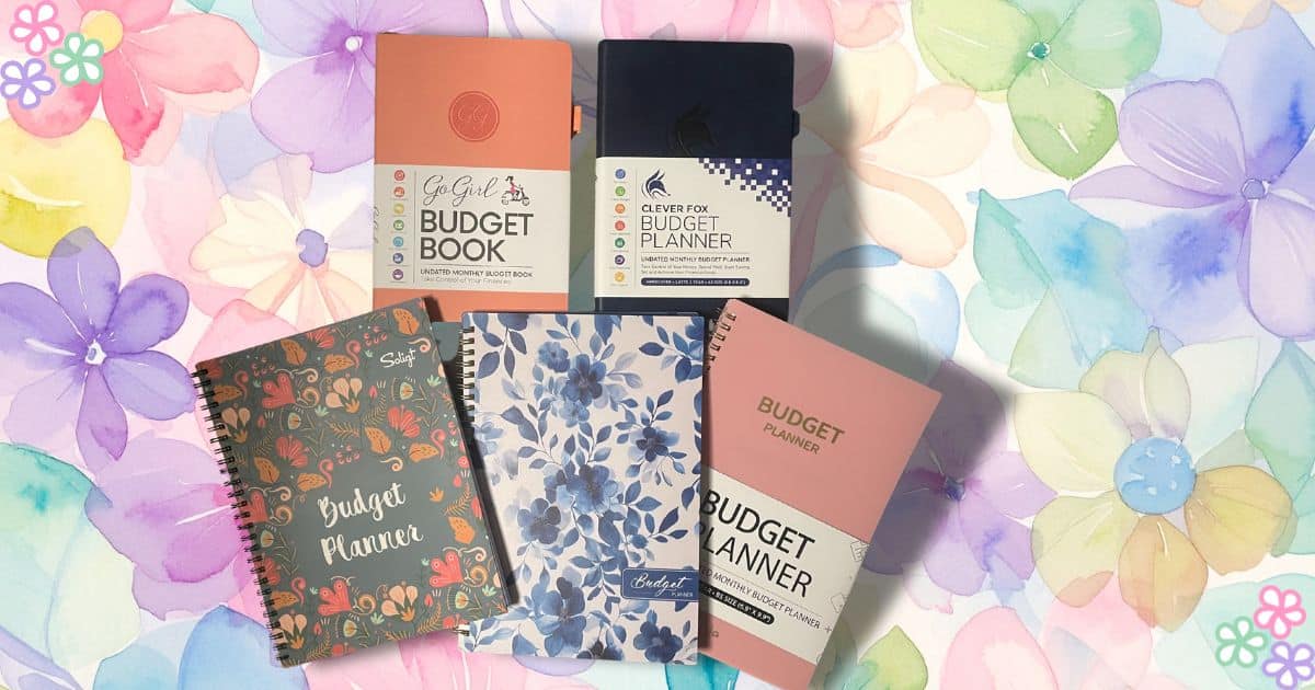 Multiple Budget Planners spread out on floral background