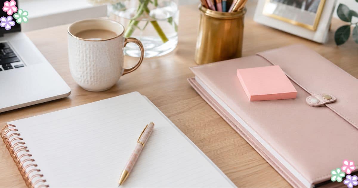 performance review featured A desk with pink and gold accessories
